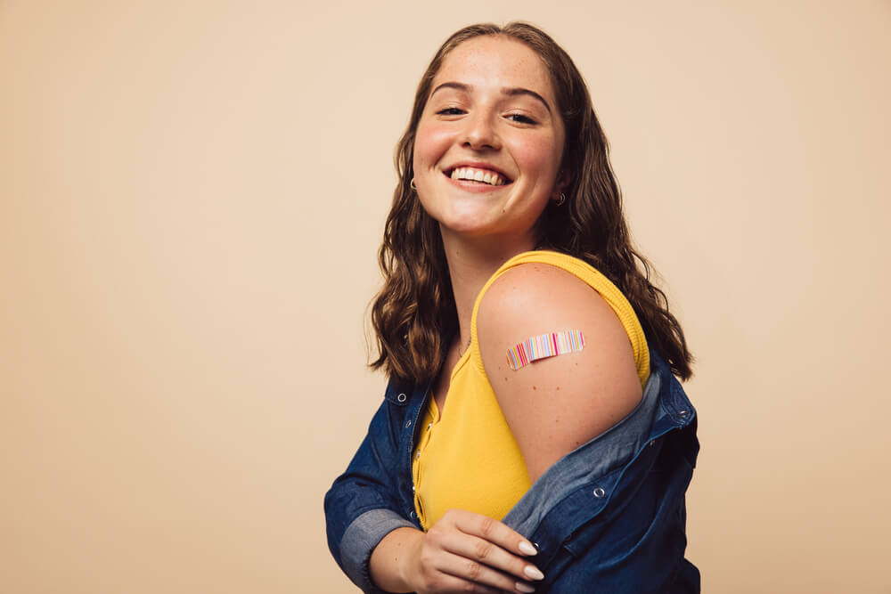 Portrait of a female smiling after getting a vaccine
