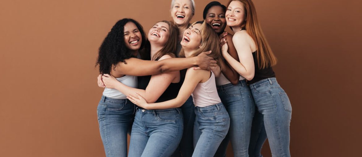 Six laughing women of a different race,
